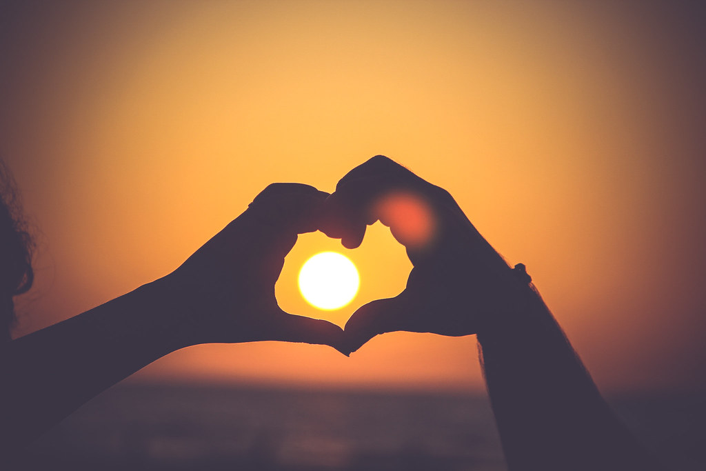 "Two Hands Making a Heart with Sunset in Background" by Image Catalog is marked under CC0 1.0. To view the terms, visit https://creativecommons.org/licenses/cc0/1.0/
